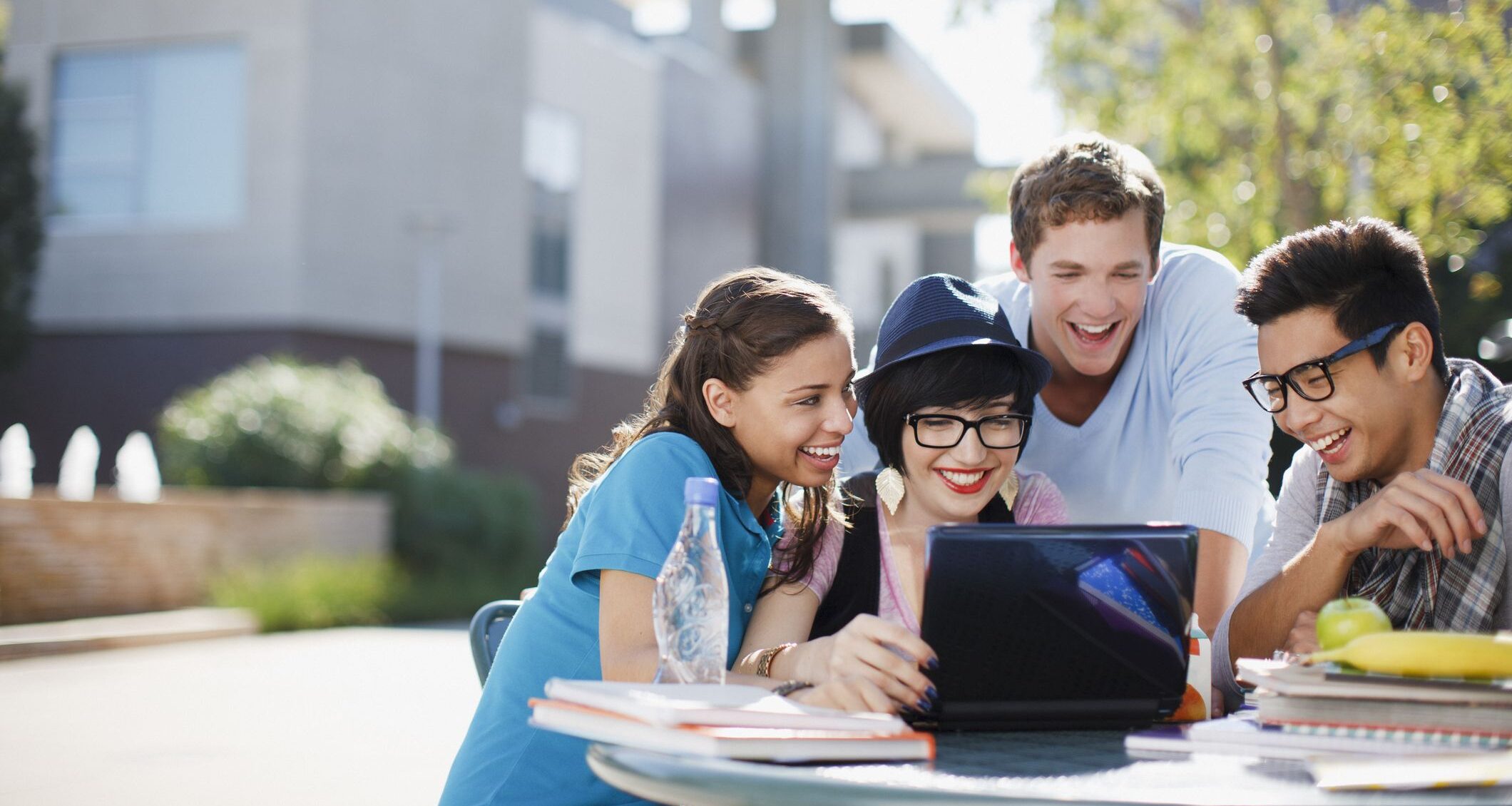 students-using-laptop-together-outdoors-royalty-free-image-1571774615
